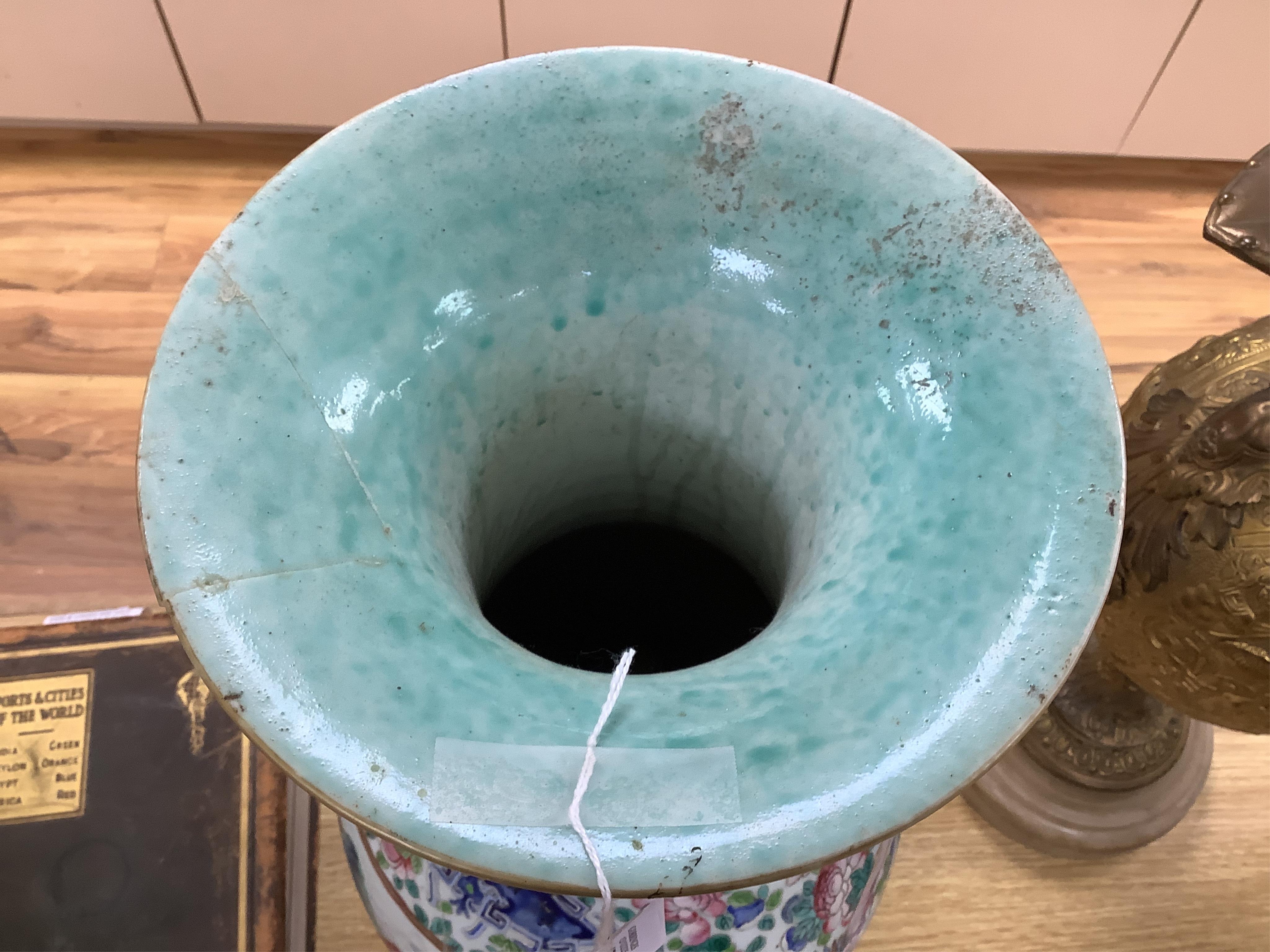 A large Chinese famille rose vase enamelled with figures and flowers, 59cm high (damaged and repaired)